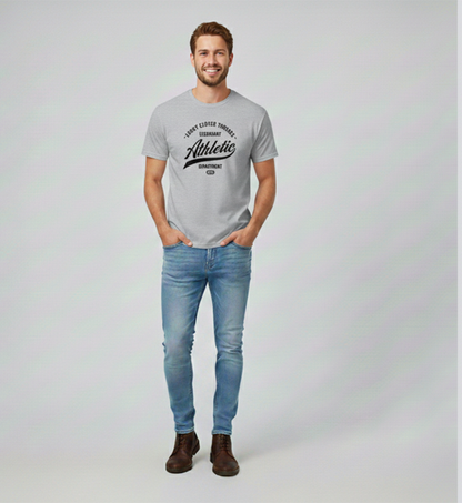 Man wearing a gray t-shirt with text and blue jeans on a white background