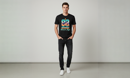 Person wearing a black t-shirt with colorful text and dark jeans on a plain background