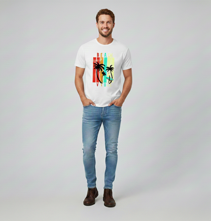 Man wearing a white t-shirt with a colorful graphic design and light blue jeans on a plain background