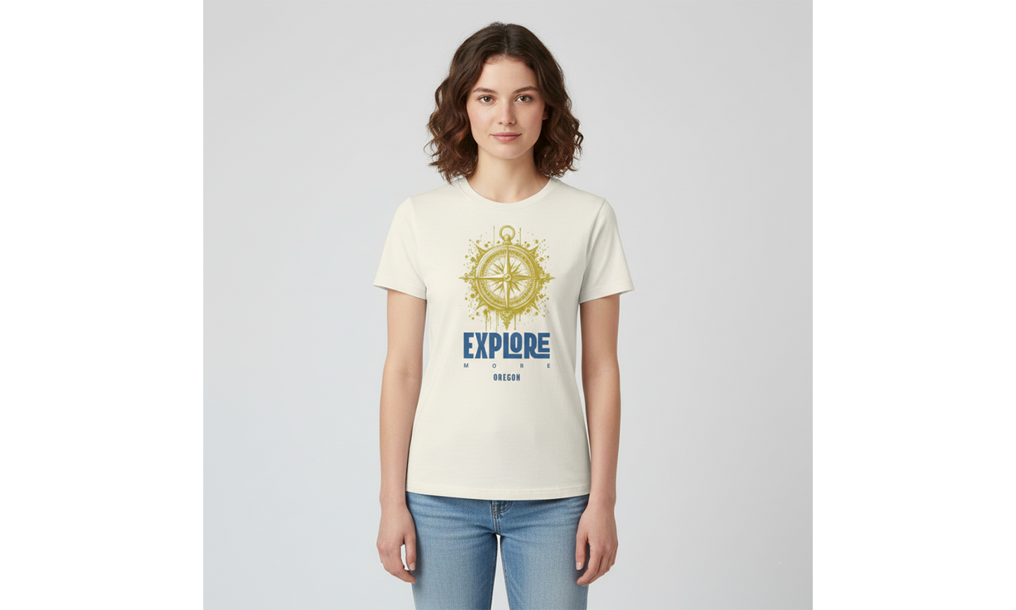 Woman wearing a cream t-shirt with a compass design and 'EXPLORE' text on a light gray background