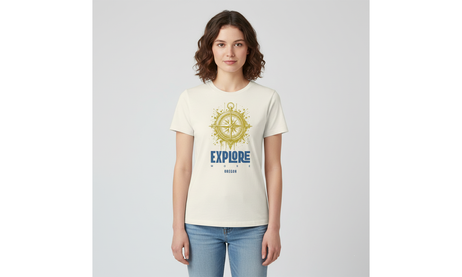 Woman wearing a cream t-shirt with a compass design and 'EXPLORE' text on a light gray background