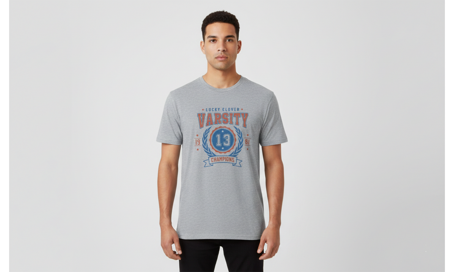 Man wearing a gray t-shirt with a graphic design on a light gray background