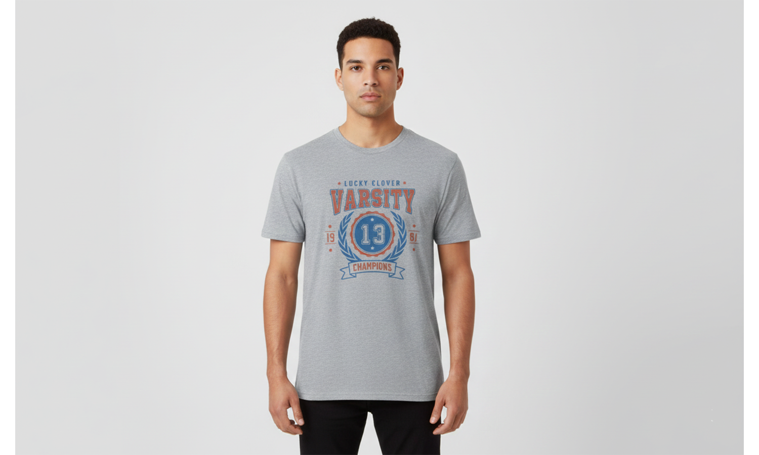 Man wearing a gray t-shirt with a graphic design on a light gray background