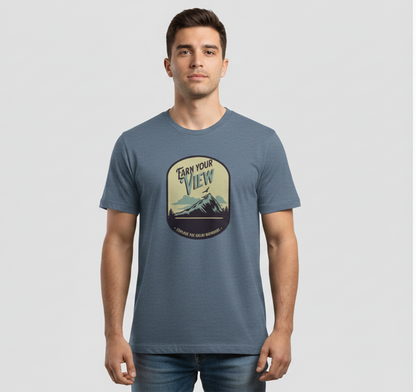 Man wearing a blue t-shirt with a graphic design on a gray background