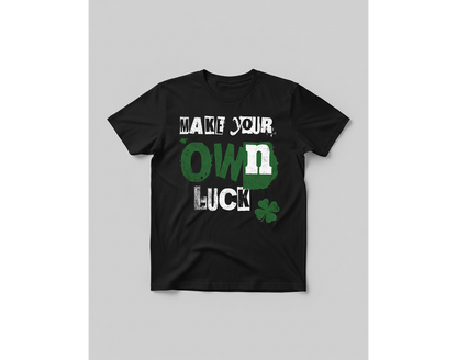 Black t-shirt with 'Make your own luck' text and clover graphic on a gray background