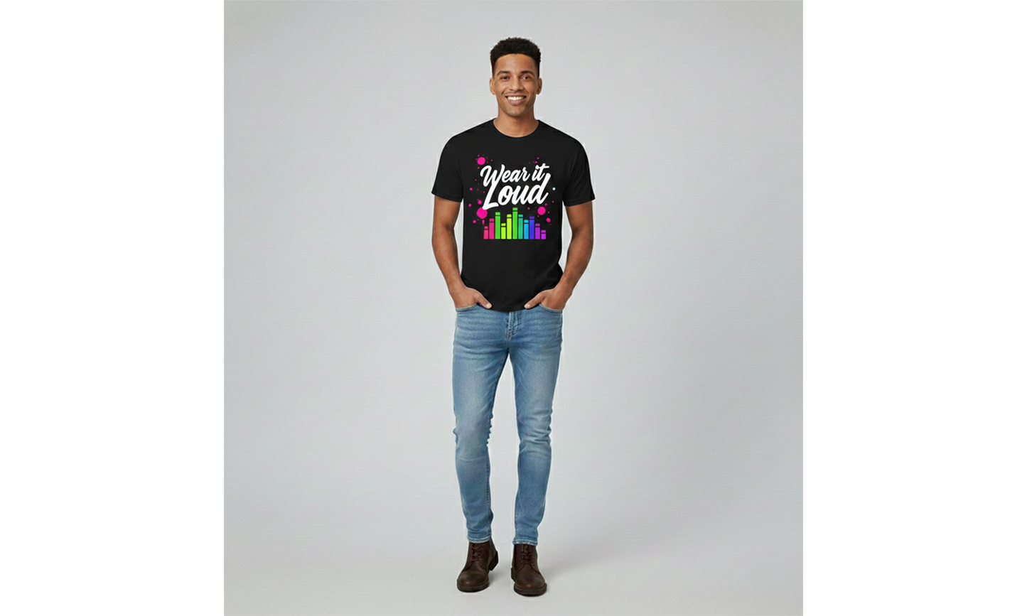 Person wearing a black t-shirt with colorful text and graphics on a plain background