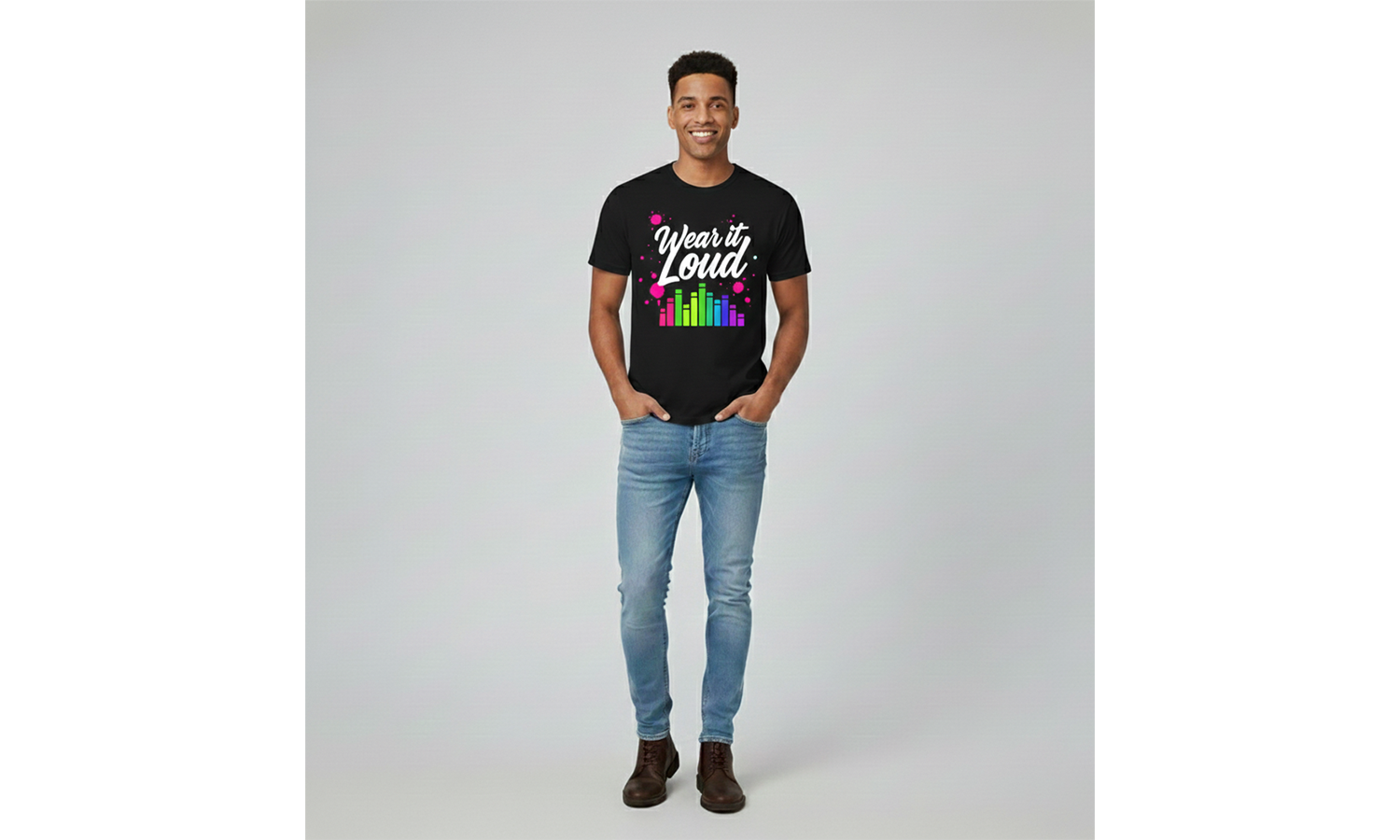 Person wearing a black t-shirt with colorful text and graphics on a plain background